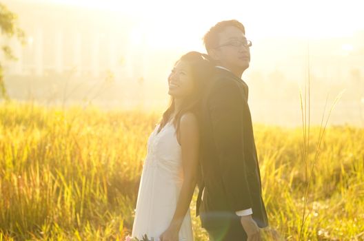 Outdoor Bride and Groom, surrounding by natural morning golden sunlight.