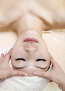 Beauty and Spa - Asian Girl having a massage on her head