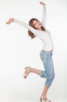 Portrait of playful pretty teenager girl against white background