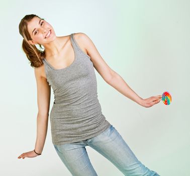 Portrait of playful pretty teenager girl against white background