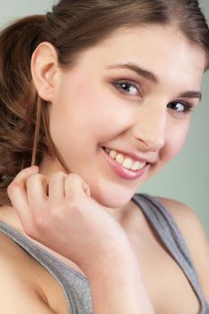 Closeup Portrait of smiling pretty teenager girl