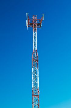 Communications tower with a beautiful blue sky