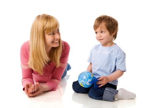 Happy mother holding globe with son isolated on white