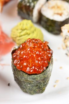 japanese sushi set with red caviar sushi in the foreground