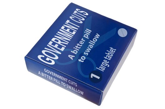 A single blue medication packagewith the words 'government cuts a bitter pill to swallow' arranged over white.