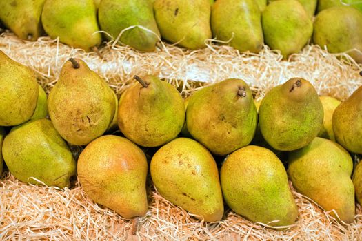 beautiful pears on display in a market
