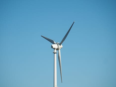 Wind turbine on a clear blue sky