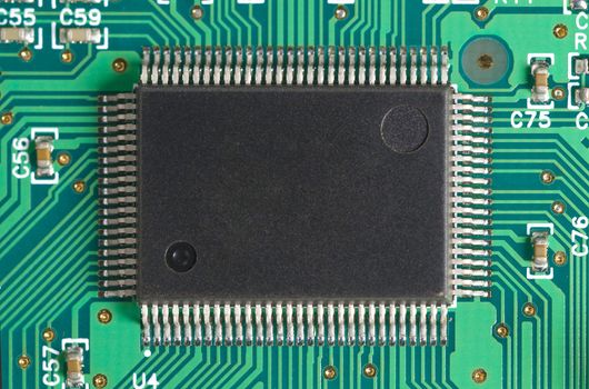 Close-up of computer chip on green board