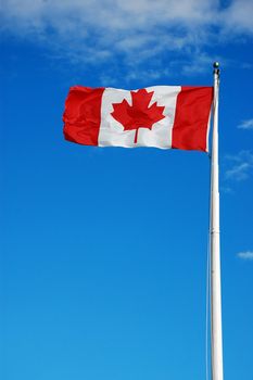 Canadian flag against blue sky