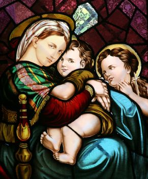 Stained glass depicting the Virgin Mary holding baby Jesus