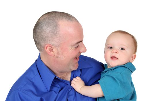 Father and son in blue shirts against white background