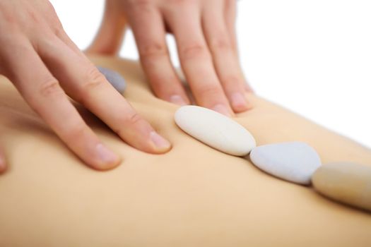 Man's hands do special massage on a female back