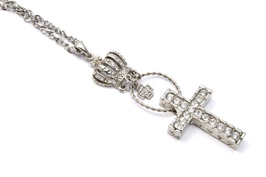Beautiful cross necklace closeup on white background