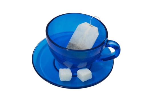 Blue teacup with tea bags and two pieces of sugar. Isolated on white background.