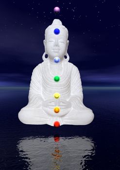 Peaceful white buddha in meditation by night upon the water and with colors chakra balls on his body