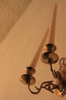 Close up of two decorative candlesticks.