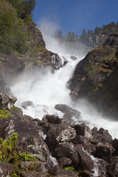 Låtefossen waterfall is a famous waterfall in Hardanger, Norway.