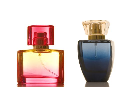 Perfume in glass bottles on white background