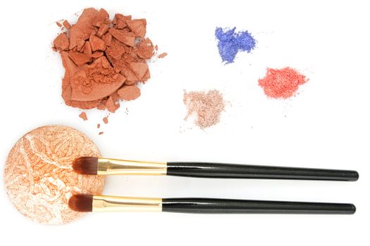 red, blue, brown powder for makeup and two brush