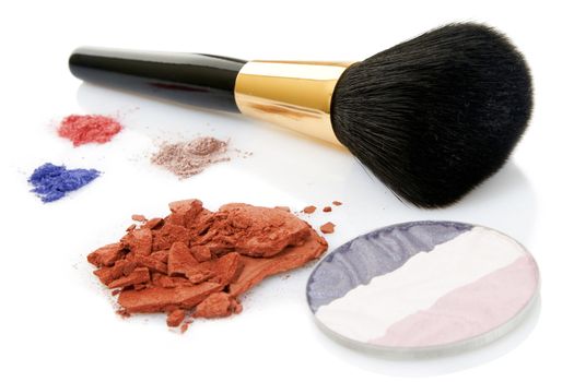 Make-up brush and different powder isolated on white background