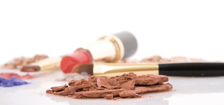 Make-up brush, lipstick and different powder isolated on white background