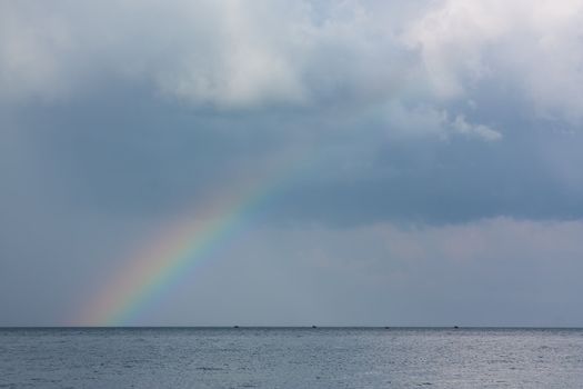 rainbow in the sky over the sea after the storm