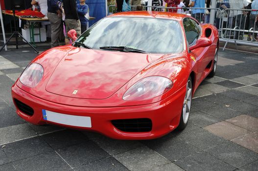 Front view of a Modena Ferrari during a meeting