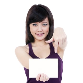 Portrait of a cute young woman holding a blank note card, isolated on white background.