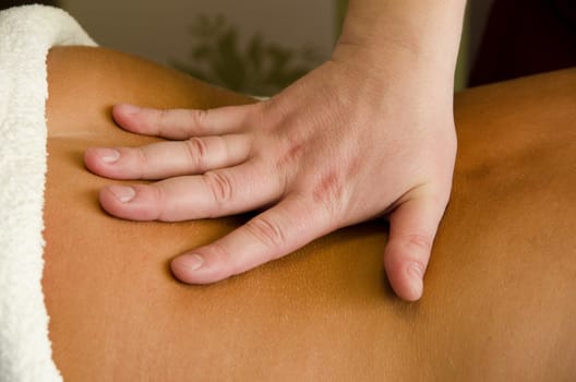 closeup of young woman getting a back massage