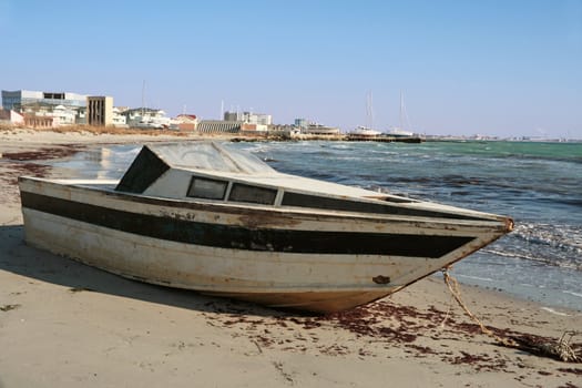 An old boat on the beach.