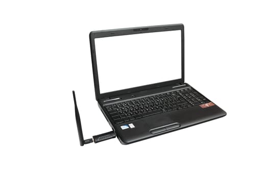 Laptop and connected to it usb Wi Fi Adapter. Isolated on white background.