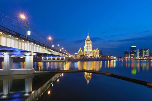  Night Moscow. Moscow River. A kind from Krasnopresnenskaya quay on hotel Ukraine and on the New Arbat bridge. 