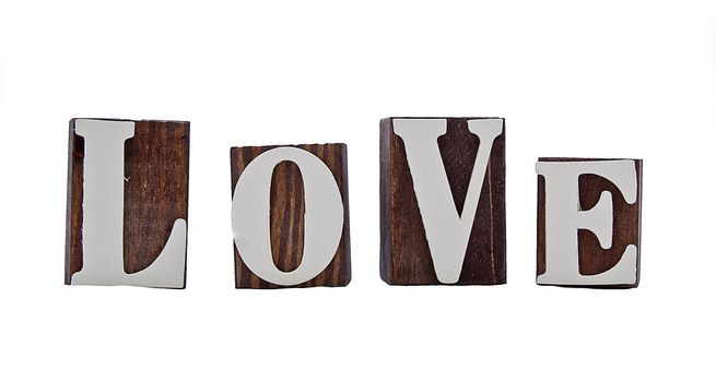 rough edged wooden blocks spelling out the word love 