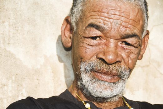 Old African black man with characterful face