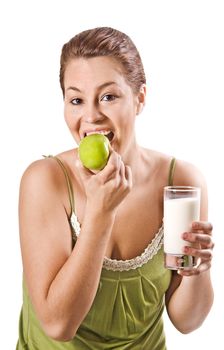Young woman enjoying healthy apple and milk