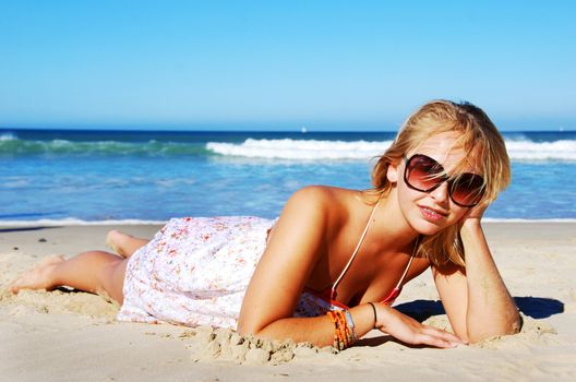 Young woman enjoying summer on the beach