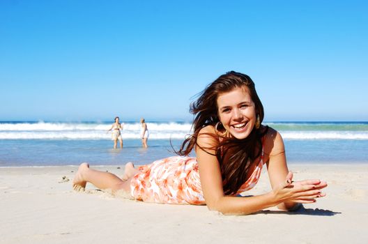 Young woman enjoying summer on the beach