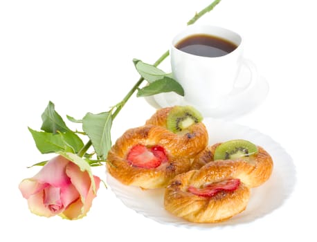 close-up rose and pastry, isolated on white