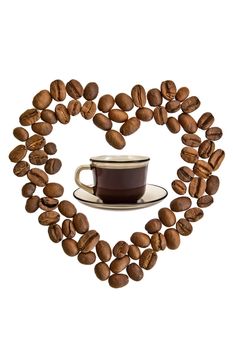 A cup of coffee and heart of the coffee beans isolated on white background