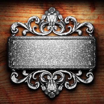 iron ornament on wood made in 3D