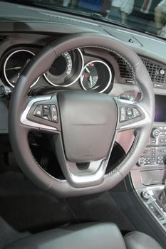 A black leather dashboard of a contemporary car