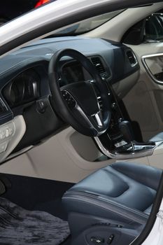 A black leather dashboard of a contemporary car