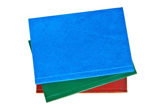 Three books blue, green and red hardback isolated on a white background