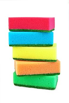 A stack of red, blue, yellow, orange and green sponges isolated on white background
