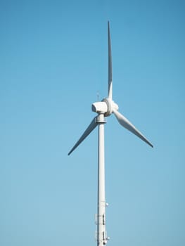 Wind turbine on a clear blue sky