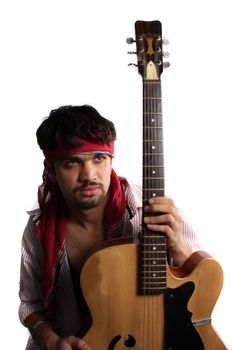 A stylish Indian guitarist, on a white studio background.