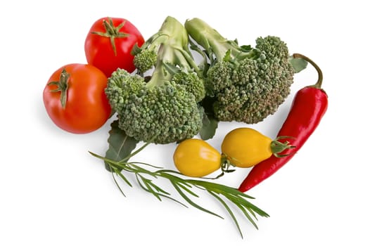 Two branches of broccoli, red peppers, red and yellow tomatoes, a sprig of tarragon isolated on a white background