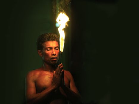 KANDY, SRI LANKA - 03 APRIL: Show of swallowing of fire for tourists in city Kandy 03 April 2011 on Sri Lanka