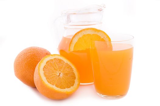 Orange juice in jug and glass over white