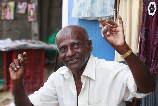 KALATURA, SRI LANKA 09 APRIL 2011: Cheerful elderly the man in the street city Kalatura 9 April 2011 on Sri Lanka